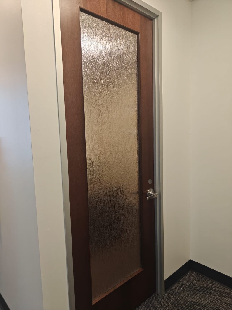 Techmines U.S. office — frosted glass entrance door